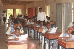 Children taking an exam.